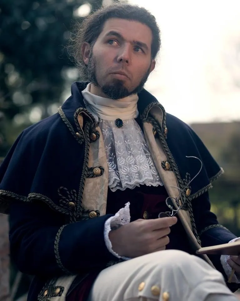 Portrait of a man in a handmade period costume with lace jabot
