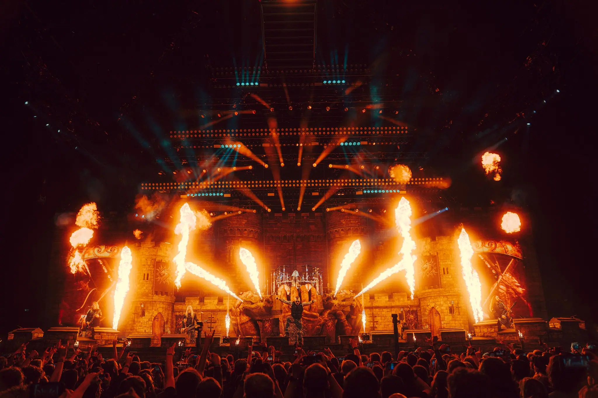 The stage of the Sabaton Legendary Tour: a wall of fire in front of a crowd, stage design by Perseus Design Studio